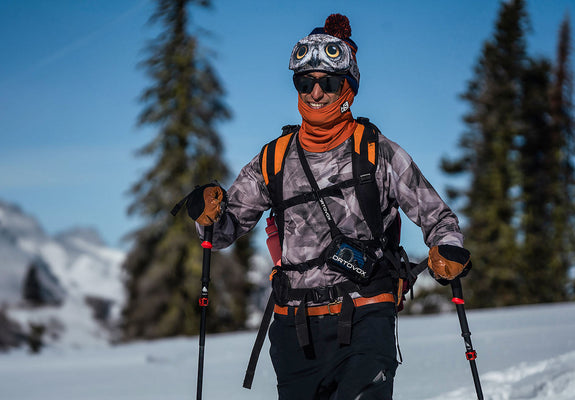 Male Splitboarder wearing the Summit Base Layer
