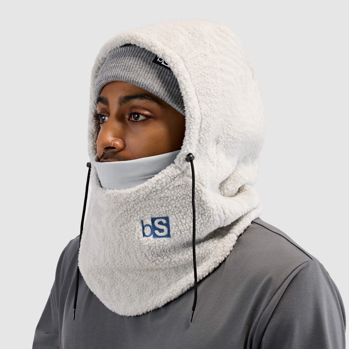 BlackStrap Caldera Hood Sherpa Fleece Overhood Inprint Ash worn by a man wearing a beanie #color_inprint-ash
