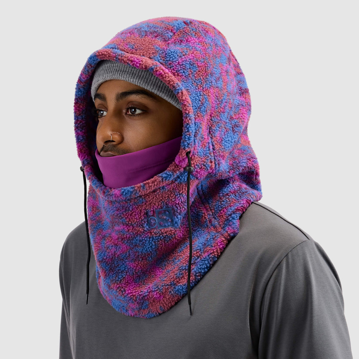 BlackStrap Caldera Hood Sherpa Fleece Overhood Pulse Currant worn by a man wearing a beanie #color_pulse-currant
