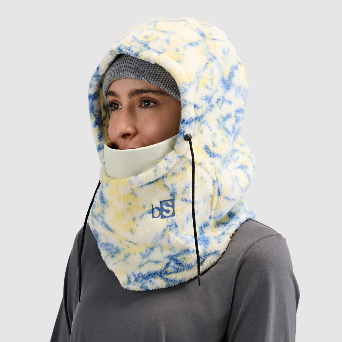 BlackStrap Caldera Hood Sherpa Fleece Overhood Pulse Orion worn by a woman wearing a beaine #color_pulse-orion