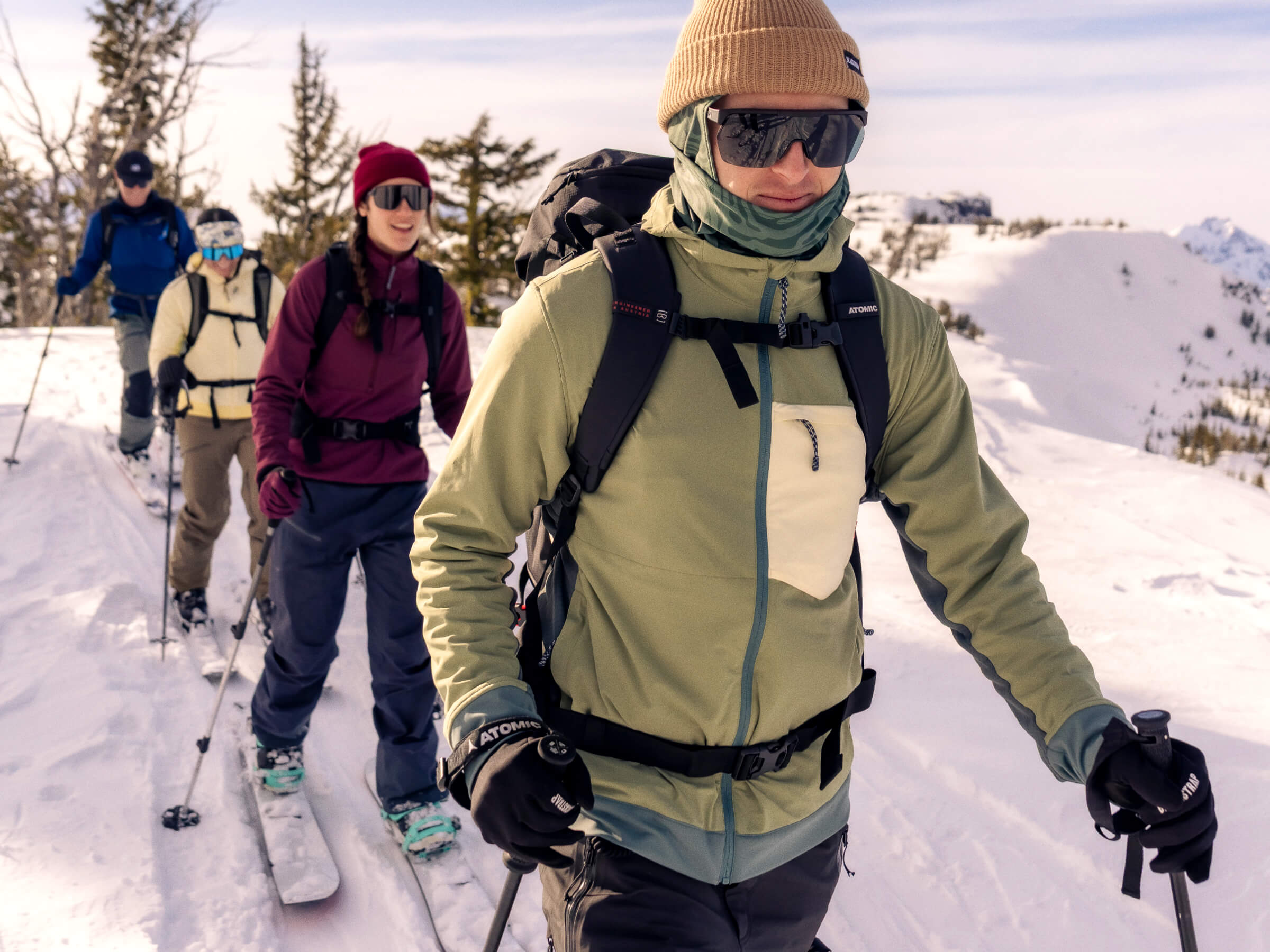 Four Friends voyaging on a ridge for an early season run in their new BlackStrap Mid Layers.