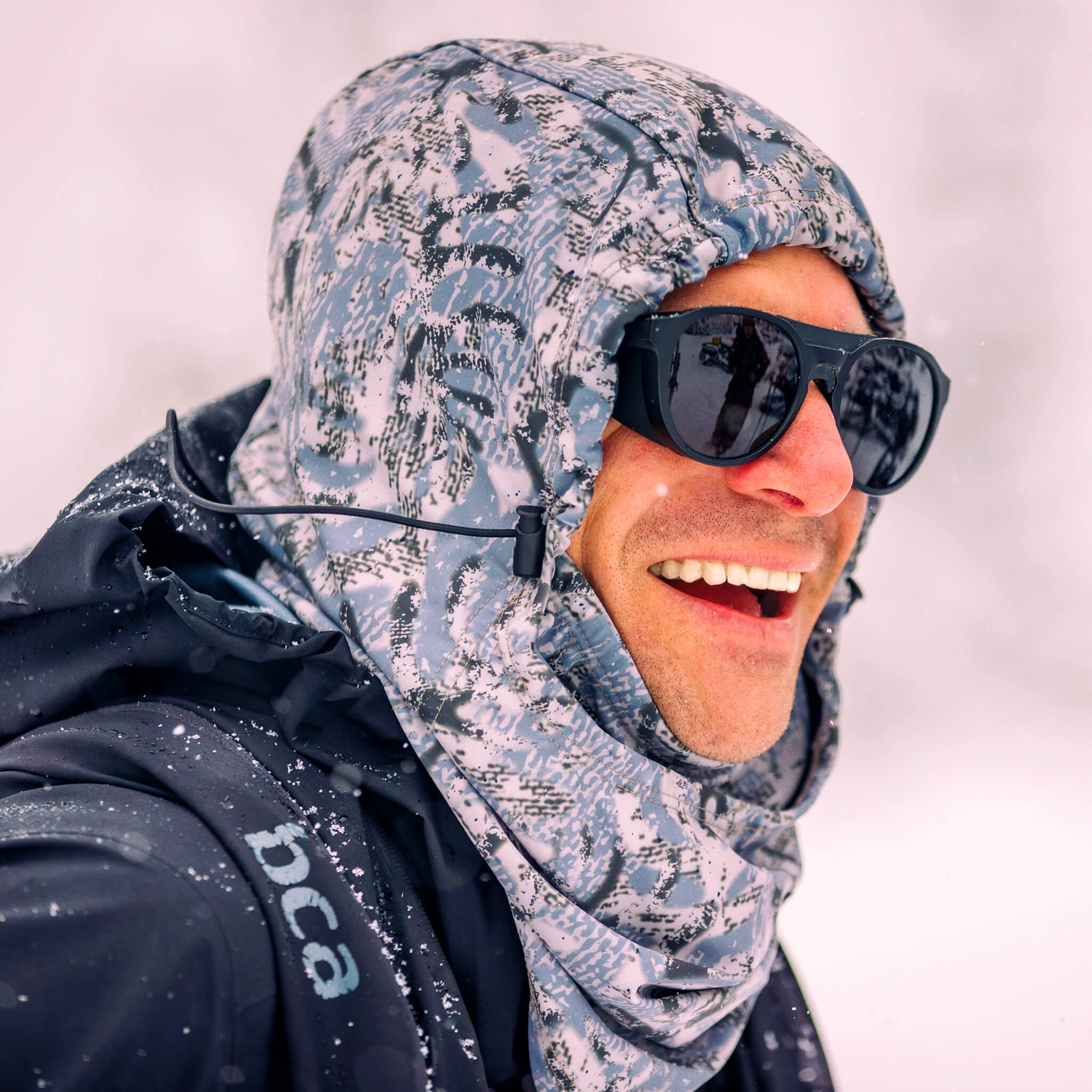 Mark Abma in a BlackStrap Team Hood on a snowy day.