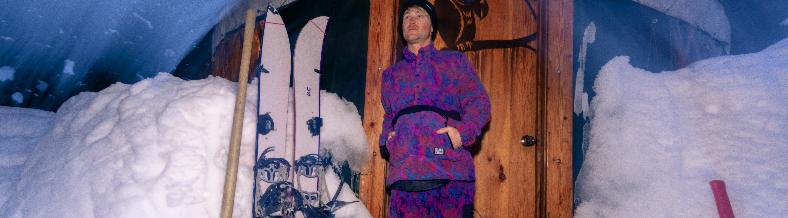 Man standing by the door in his Caldera Fleece Midlayers waiting for the sun to rise