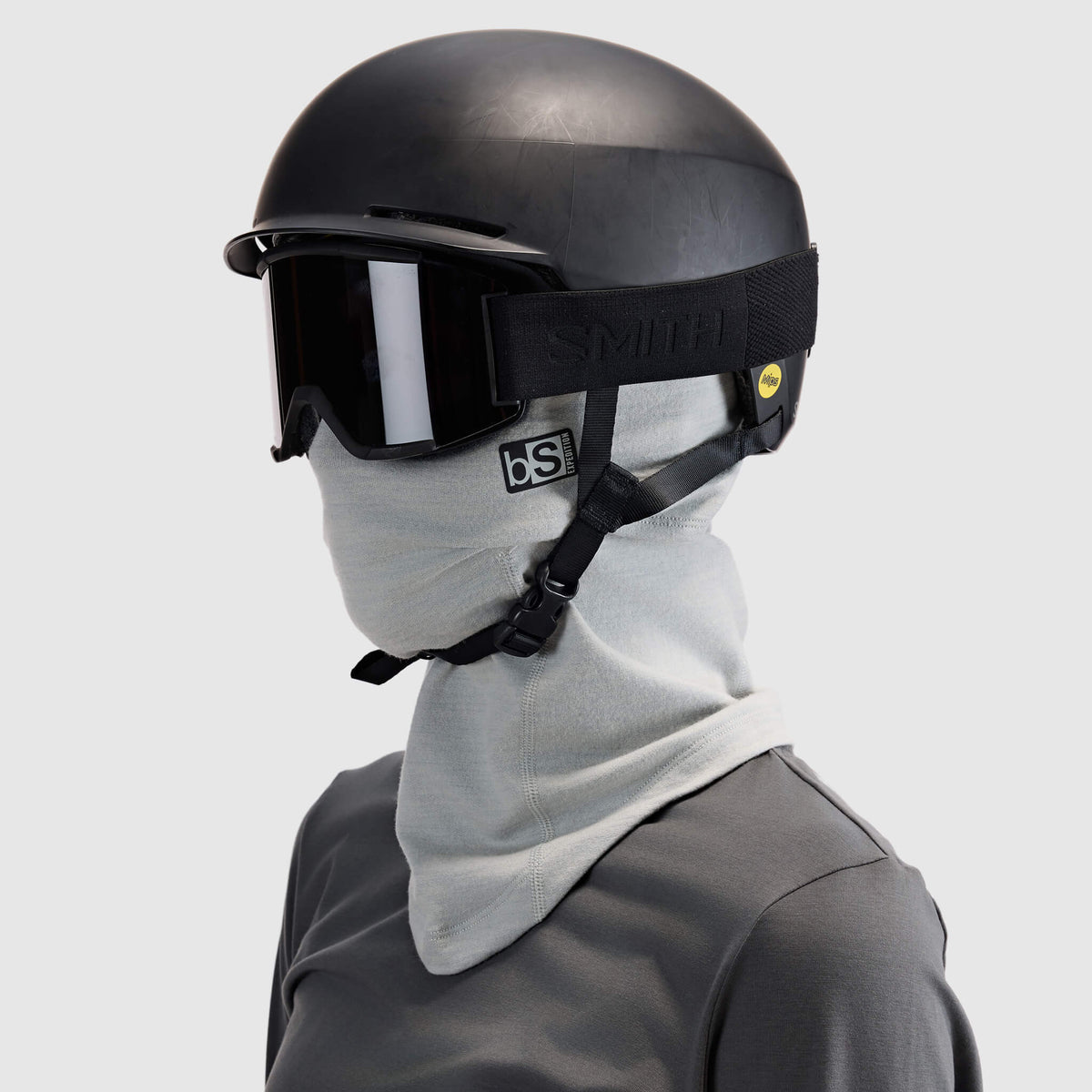 BlackStrap Merino Expedition Hood Balaclava worn as a full ski mask under a helmet and ski goggles