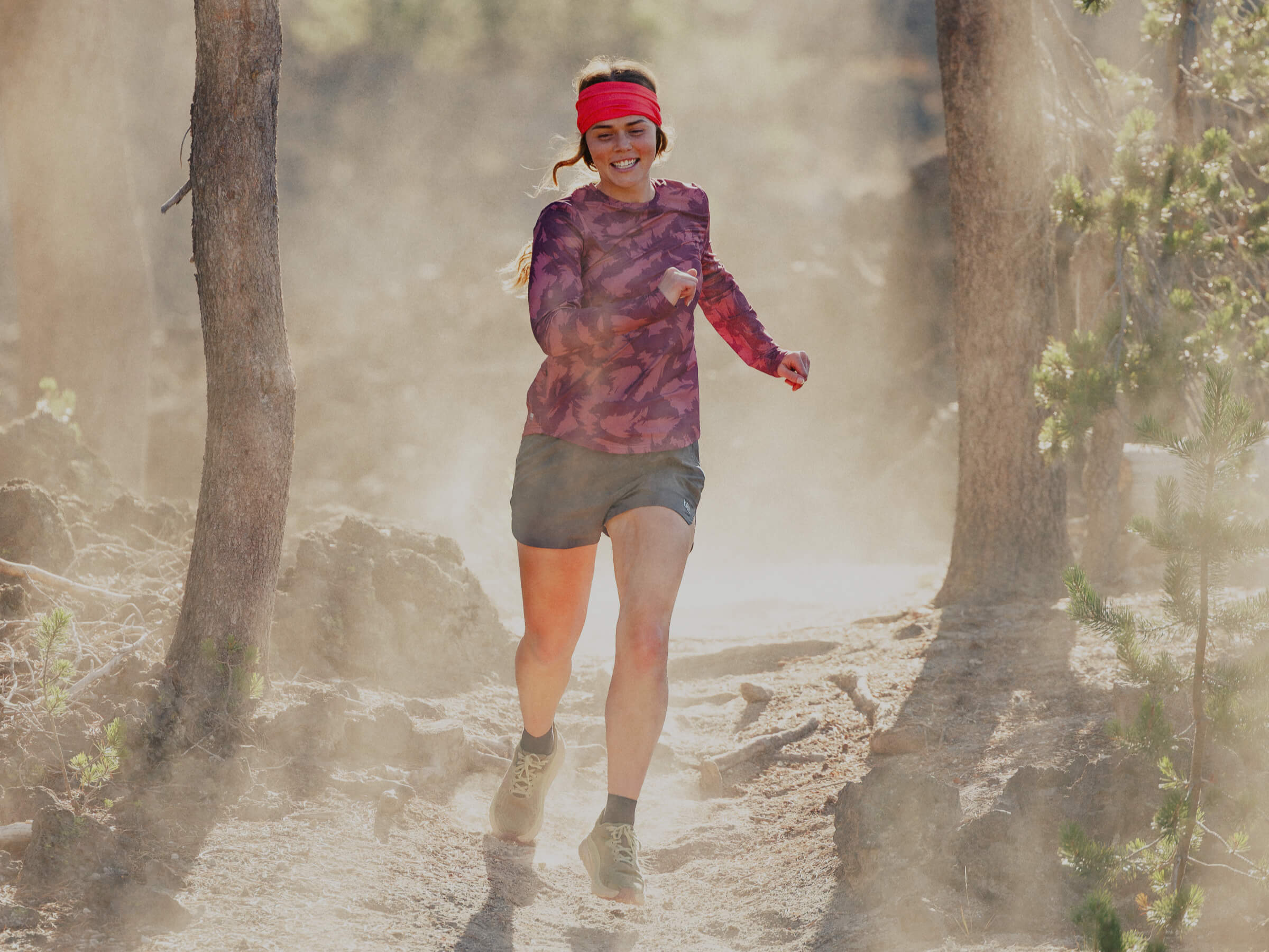 Female trail runner wearing BlackStrap cooling and sun protective layers.