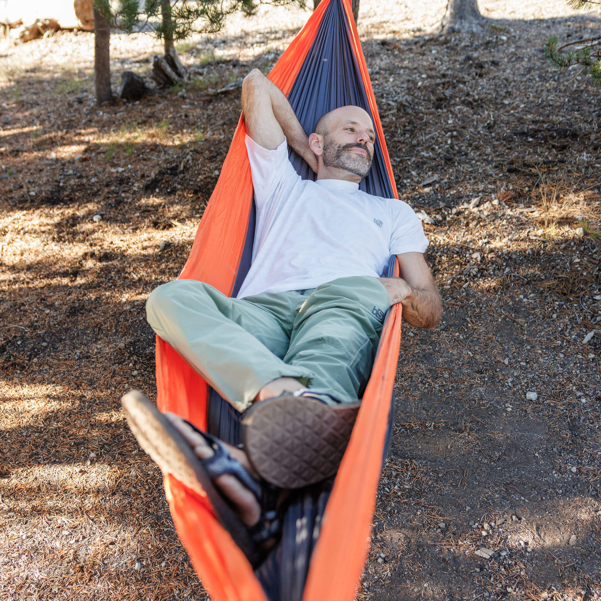 Man reclining in a hammock outdoors wearing the BlackStrap Men's Aspect Tee