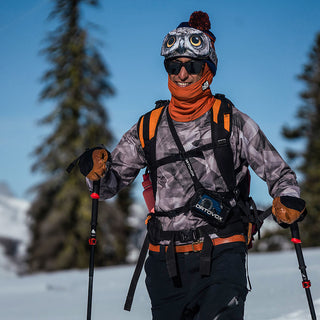 Male Splitboarder wearing the Summit Base Layer