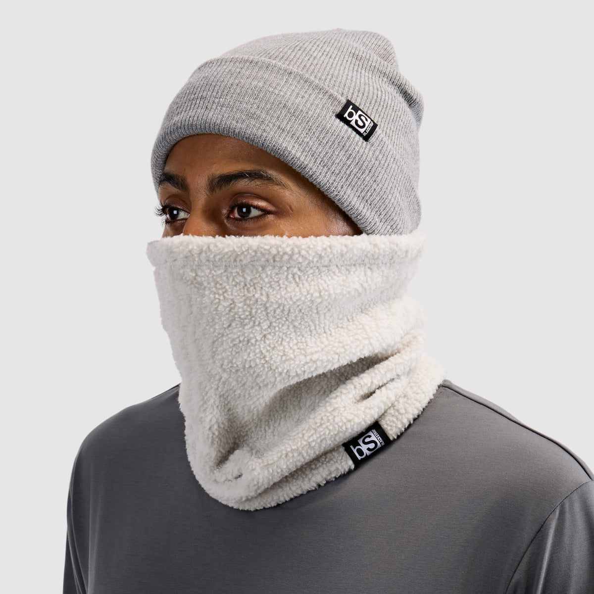 BlackStrap Caldera Sherpa Fleece Tube Neck Gaiter Inprint Ash worn by a man with a beanie #color_inprint-ash