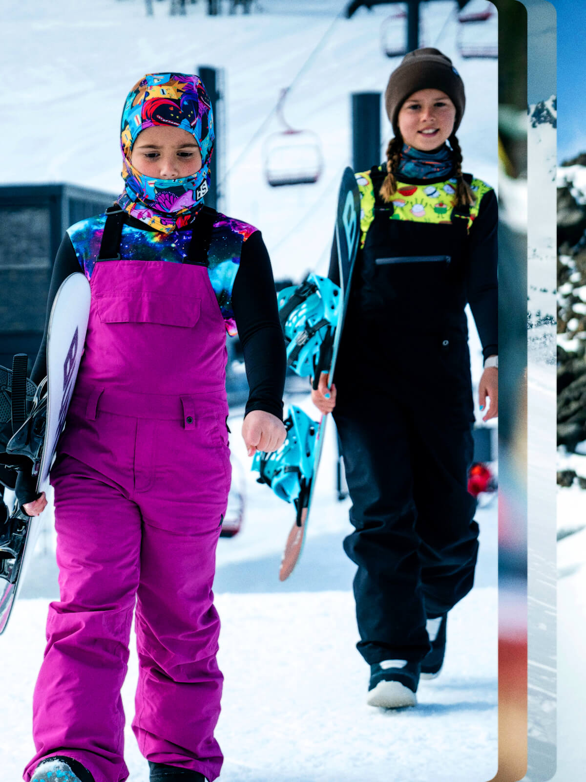 Two kids preparing for an awesome day up at the mountain in their blackStrap Facemasks and Base Layers.