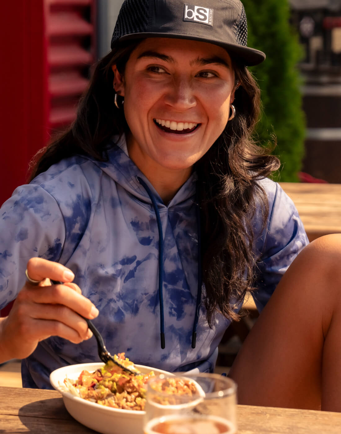 Enjoying a nice meal after all of the day's adventures wearing the BlackStrap Aspect Hoodie