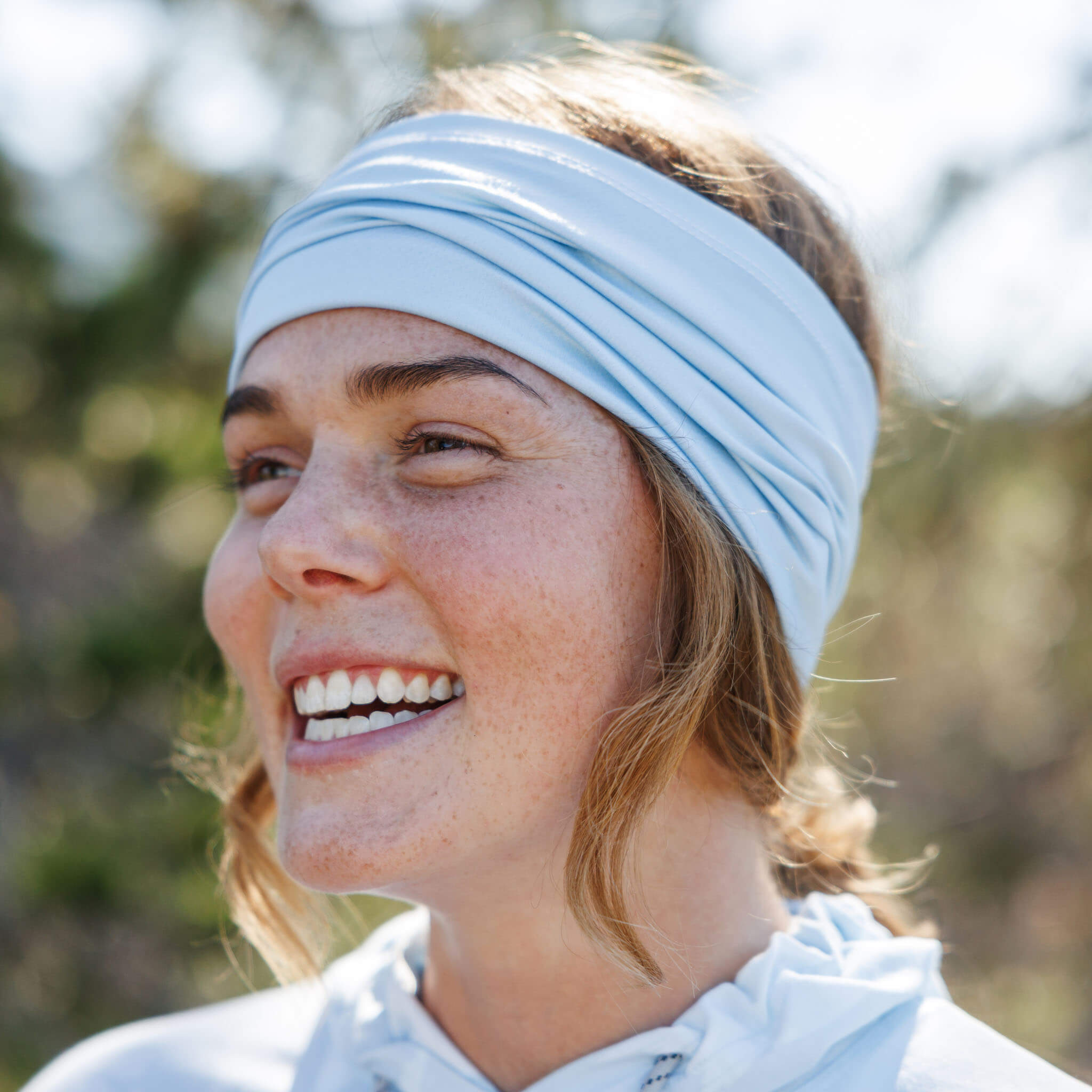 Close-up of a woman wearing a BlackStrap Multifunctional Headband